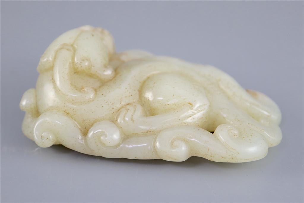 A Chinese pale celadon jade figure of a chilong, 10.2cm